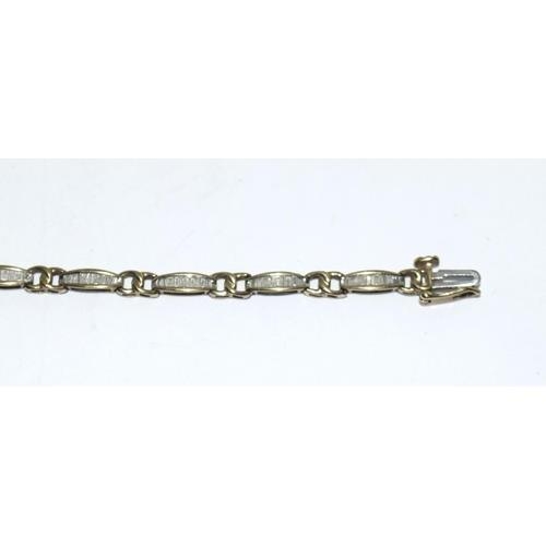 219 - 9ct gold ladies Diamond bracelet set with bagget cut diamonds of approx 2ct tota