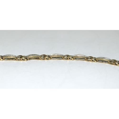 219 - 9ct gold ladies Diamond bracelet set with bagget cut diamonds of approx 2ct tota