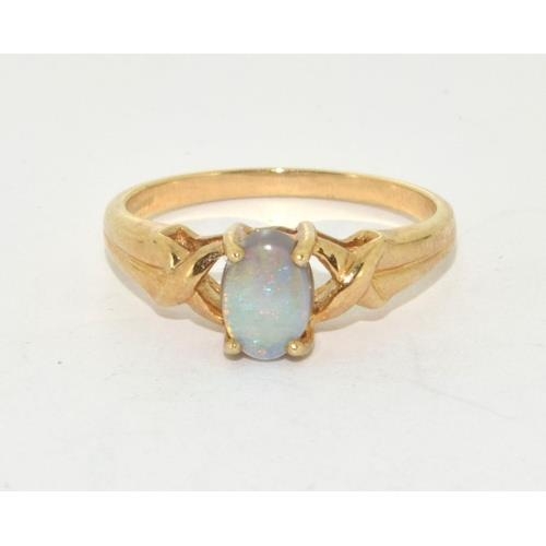 73 - 9ct gold ladies Opal solitaire ring with twist setting size N