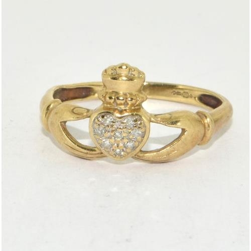 60 - 9ct gold ladies Diamond set hands of friendship ring size O