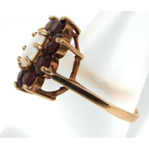 284 - 9ct gold ladies Garnet and Opal ring size N