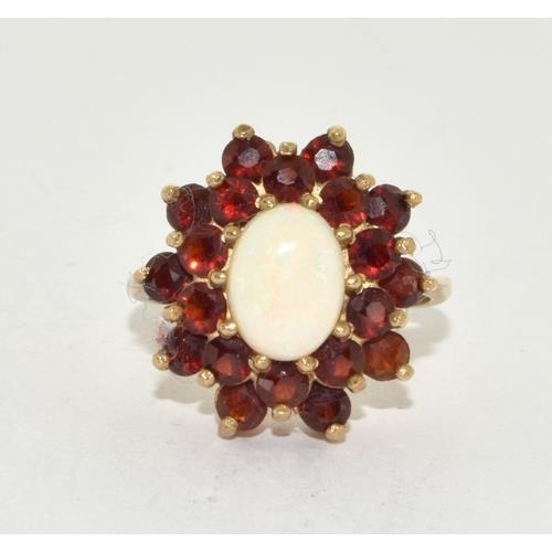 5 - 9ct gold ladies Opal and Garnet cluster ring in the halo pattern size O