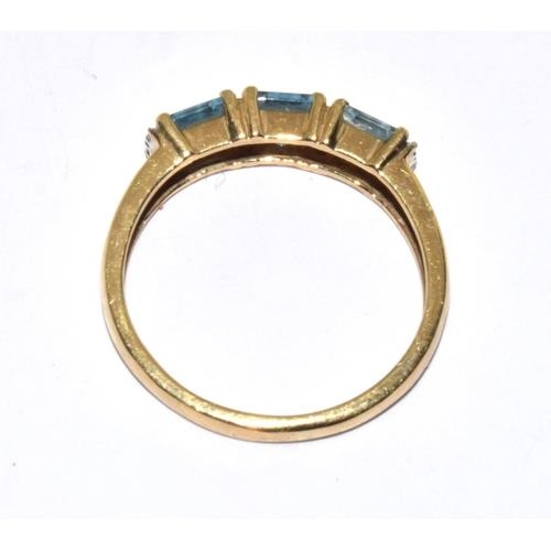 56 - 9ct gold ladies 3 stone Blue Topaz ring size O