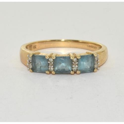 56 - 9ct gold ladies 3 stone Blue Topaz ring size O