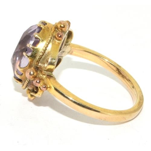 291 - 9ct gold ladies oval Amethyst in an ornate bezel setting solitaire statement ring size M