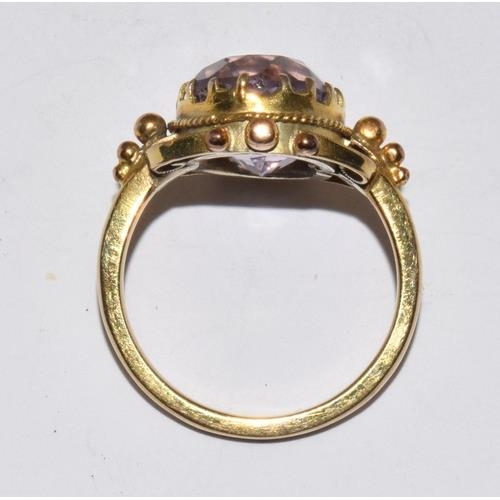 291 - 9ct gold ladies oval Amethyst in an ornate bezel setting solitaire statement ring size M