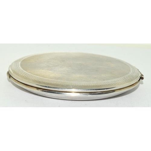 62 - 925 silver engine turned ladies compact with mirror and pad 9cm diameter