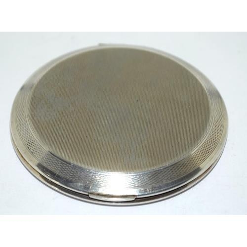 62 - 925 silver engine turned ladies compact with mirror and pad 9cm diameter