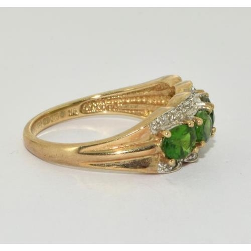 99 - 9ct gold ladies Diamond and emerald green stone ring size P