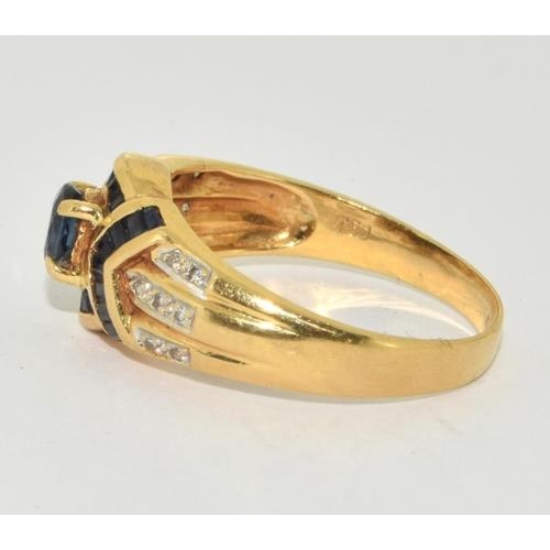 257 - 18ct gold ladies diamond and sapphire ring size O