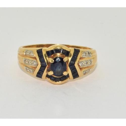 257 - 18ct gold ladies diamond and sapphire ring size O