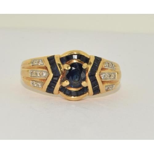 257 - 18ct gold ladies diamond and sapphire ring size O