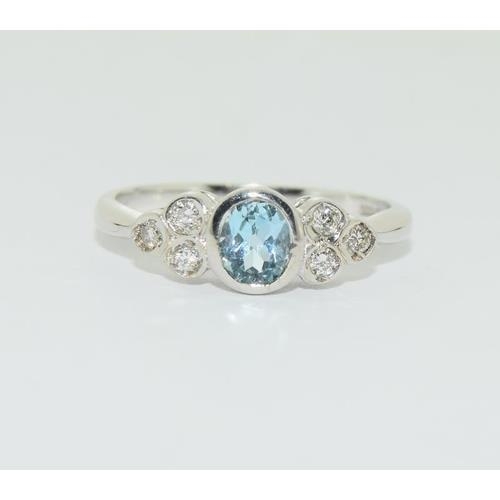 191 - 9ct white gold aquamarine diamond ring, size L