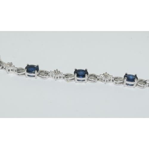 249 - A silver sapphire bracelet.