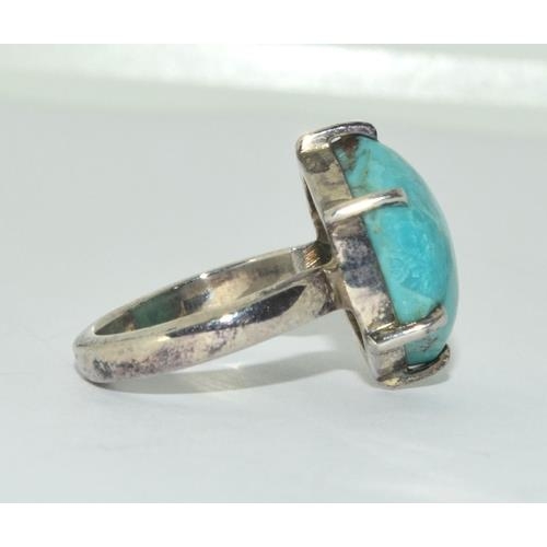 229 - A silver turquoise ring Size O.