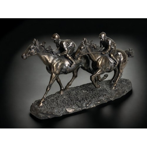 158 - THREE RESIN HORSE RACING JOCKEY FIGURINES. 
LARGEST 15