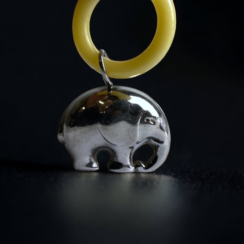 80 - A VICTORIAN BABY RATTLE AND TEETHING RING, WITH SILVER PLATED ELEPHANT.
8CM TALL