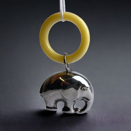 80 - A VICTORIAN BABY RATTLE AND TEETHING RING, WITH SILVER PLATED ELEPHANT.
8CM TALL