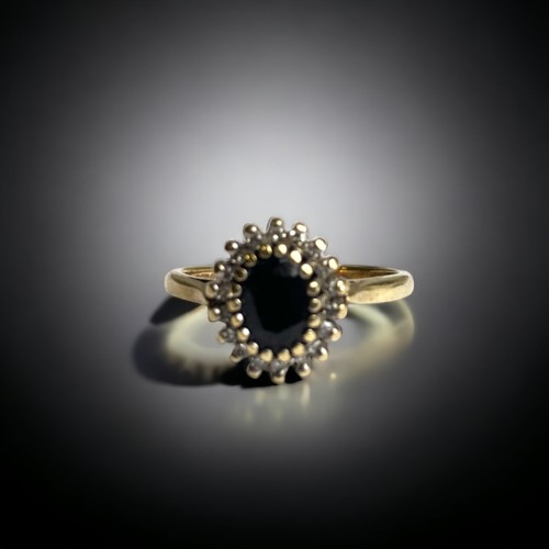 81 - A 9CT GOLD, DIAMOND & SAPPHIRE LADIES CLUSTER RING.
SIZE L
2.3 GRAMS