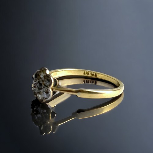 83 - A CONTINENTAL 18K GOLD AND DIAMOND LADIES CLUSTER RING.
SIZE N 1/2
1.8 FRAMS