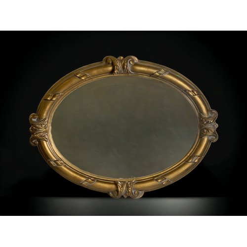 10 - A LARGE OVAL GILT MIRROR. 
96 X 73CM