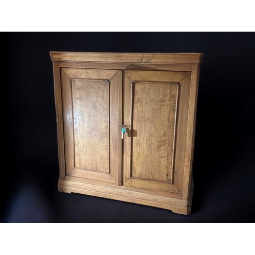 15 - A LARGE VICTORIAN WAXED PINE CUPBOARD.
TWIN LOCKING DOORS.
MISSING INTERNAL SHELVES.
4.8 X 4.6 FOOT.