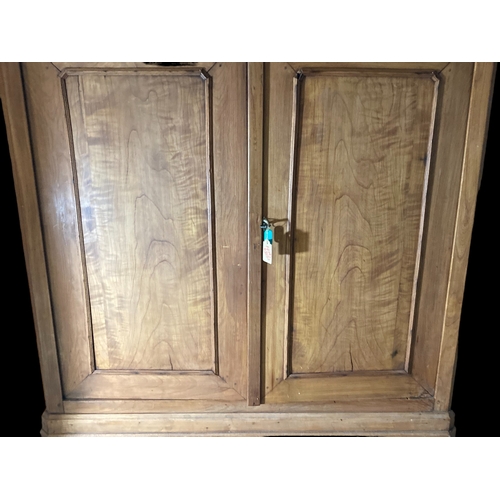 15 - A LARGE VICTORIAN WAXED PINE CUPBOARD.
TWIN LOCKING DOORS.
MISSING INTERNAL SHELVES.
4.8 X 4.6 FOOT.