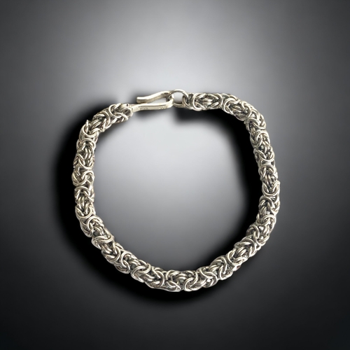 102 - A STERLING SILVER LADIES BRACELET. 
7.25