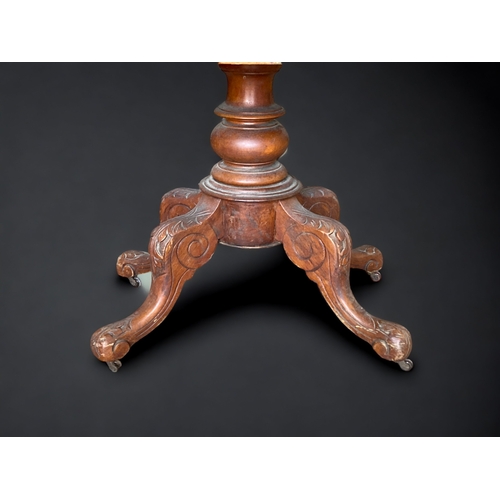 30 - A VICTORIAN CARVED PEDESTAL TILT-TOP DINING TABLE.