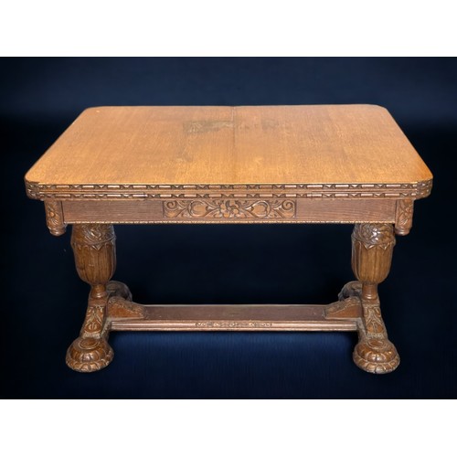 58 - A VICTORIAN CARVED OAK EXTENDING DINING TABLE.