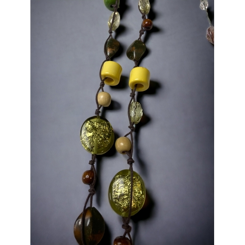 105A - A COLLECTION Of COSTUME JEWELLERY NECKLACES INCLUDING ABALONE SHELL.