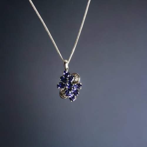 110B - A WHITE GOLD ON STERLING SILVER TANZANITE PENDANT NECKLACE.