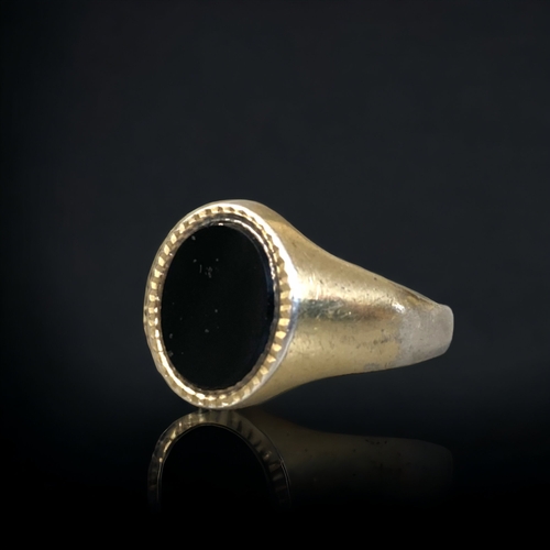 151C - A GOLD ON SILVER ONYX SET MENS RING TOGETHER WITH ON OTHER.