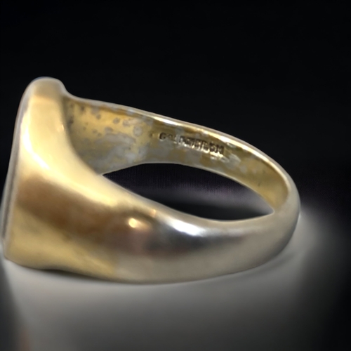 151C - A GOLD ON SILVER ONYX SET MENS RING TOGETHER WITH ON OTHER.