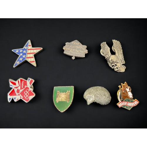 128 - A COLLECTION OF BADGES ETC