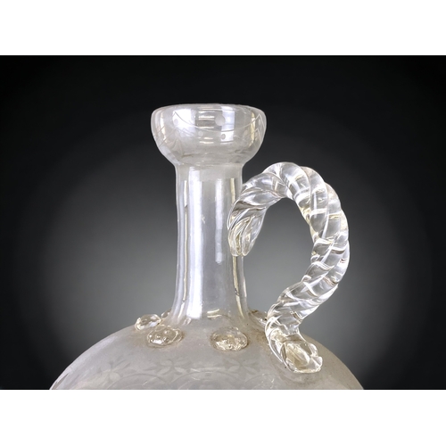 68 - A 19TH CENTURY GLASS DECANTER. ENGRAVED STYLISED & KNOBBED DESIGN. 
24CM TALL.