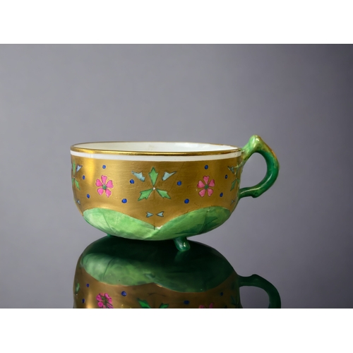 74 - A VICTORIAN MINTON PORCELAIN  TEACUP & SAUCER. ATTRIBUTED TO CHRISTOPHER DRESSER. 
HAND PAINTED ENAM... 