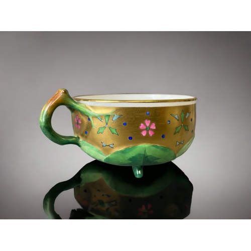 74 - A VICTORIAN MINTON PORCELAIN  TEACUP & SAUCER. ATTRIBUTED TO CHRISTOPHER DRESSER. 
HAND PAINTED ENAM... 