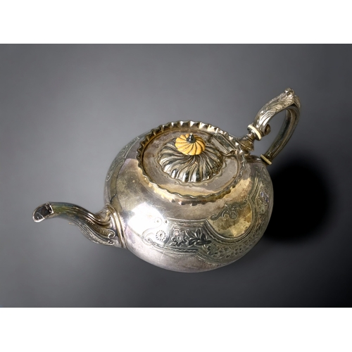 83 - AN ANTIQUE SILVER PLATE TEAPOT. STYLISED DESIGN.
LATE VICTORIAN / EDWARDIAN.