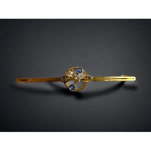 151 - A 9ct gold and Tanzanite Seed Pearl tie pin/brooch.
57mm long