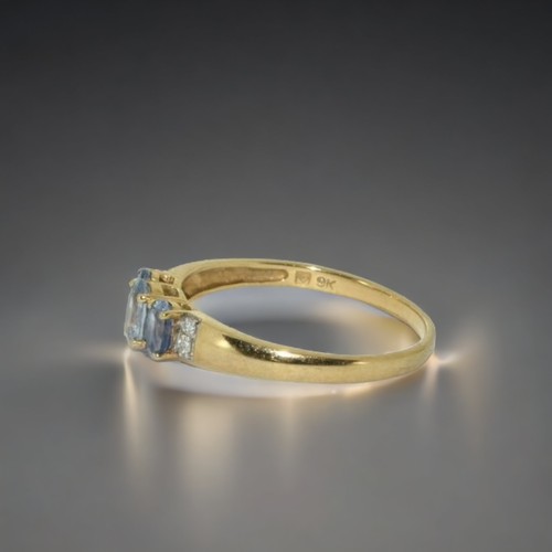 153 - A 9ct gold ladies Diamond and Tanzanite ring.
Size W.