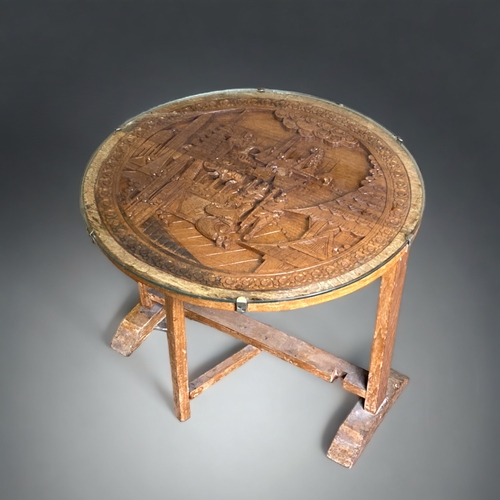 5 - A VINTAGE CHINESE GLAZED TILT-TOP TEA TABLE. DEEP CARVED DESIGN, WITH GLASS TOP.