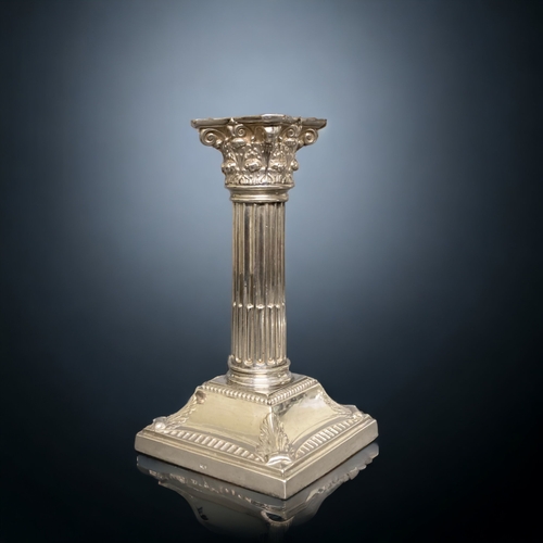 124 - A PAIR OF STERLING SILVER CORINTHIAN CANDLESTICKS. BY JAMES DEAKIN & SONS.
14.5CM TALL.