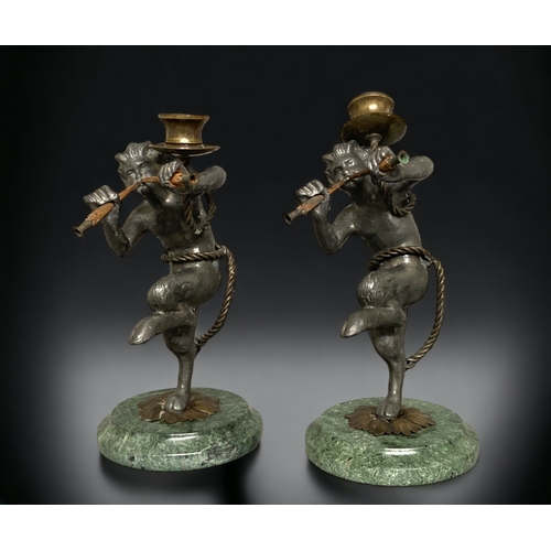 240 - A PAIR OF GRAND TOUR MIXED METAL CANDLESTICKS. DEPICTING FAUN FIGURES. ON MARBLE BASES.
25CM TALL