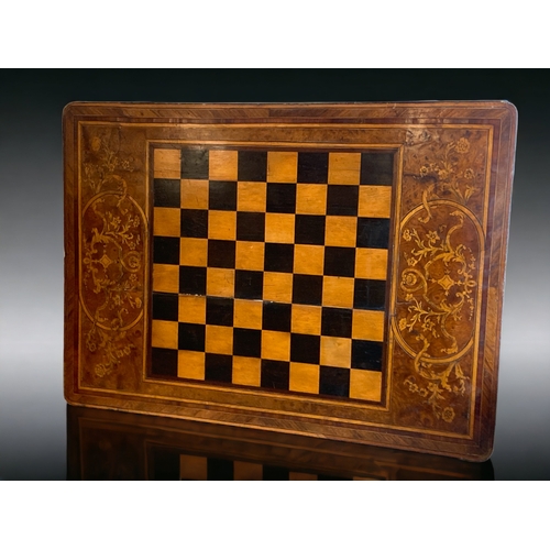 6 - A LARGE VICTORIAN WALNUT INLAID GAMES BOARD / TABLE TOP. ONE SIDE INLAIDSTYLISED DESIGN BORDERING A ... 