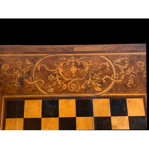 6 - A LARGE VICTORIAN WALNUT INLAID GAMES BOARD / TABLE TOP. ONE SIDE INLAIDSTYLISED DESIGN BORDERING A ... 