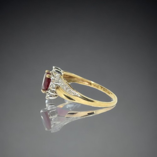 152 - A9ct gold ladies Diamond and Ruby heart ring.
Size P