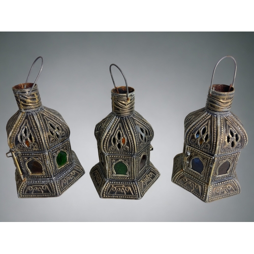 233 - A GROUP OF PERSIAN STYLE CANDLE LANTERNS.