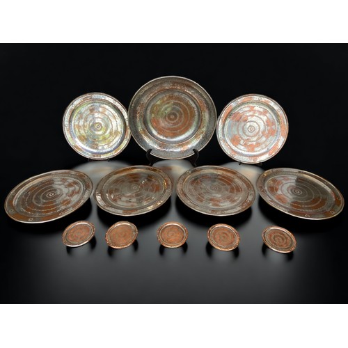 180 - A COLLECTION OF ALLA MONDA TINNED COPPER DISHES AND COASTERS.
large dish 36cm diameter, 
six dishes ... 