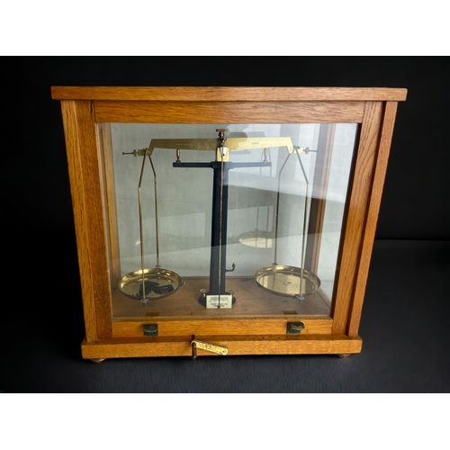 406 - SCIENTIFIC SCALES IN GLASS CASE.